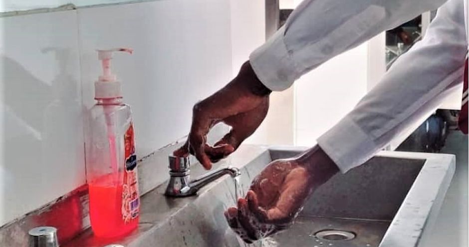 hands in sink