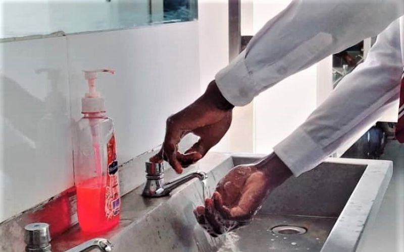 hands in sink